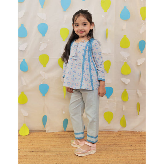 Young girl in a light blue outfit.