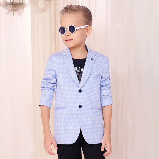 Boy in pastel blue textured blazer paired with black cargo pants and sunglasses
