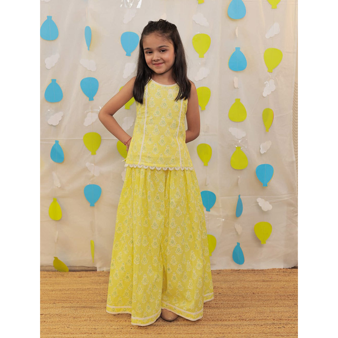 Young girl in a yellow sharara.